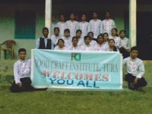 Holding a Poster of food craft institute, Tura