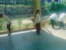 Girls are cleaning the garden