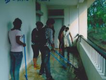 Students are cleaning the Corridor